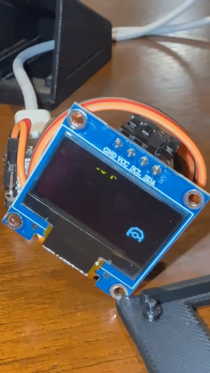 OLED screen showing the bouncing pokeball clock